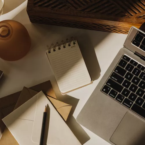 Integrated seo & website operations planning notes and documents on a workspace desk